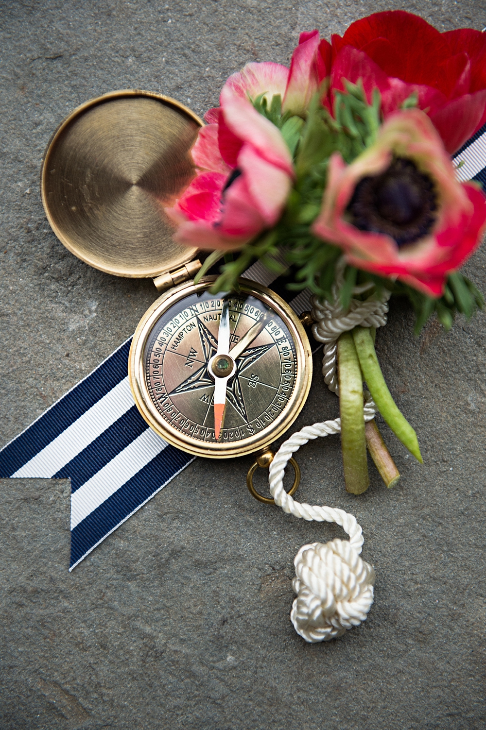 Nautical wedding details with a compass wedding favor