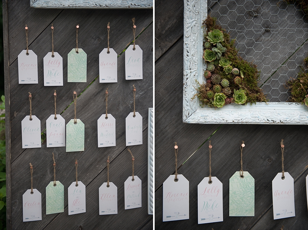 Wooden escort wall display with hanging tags, moss and frames