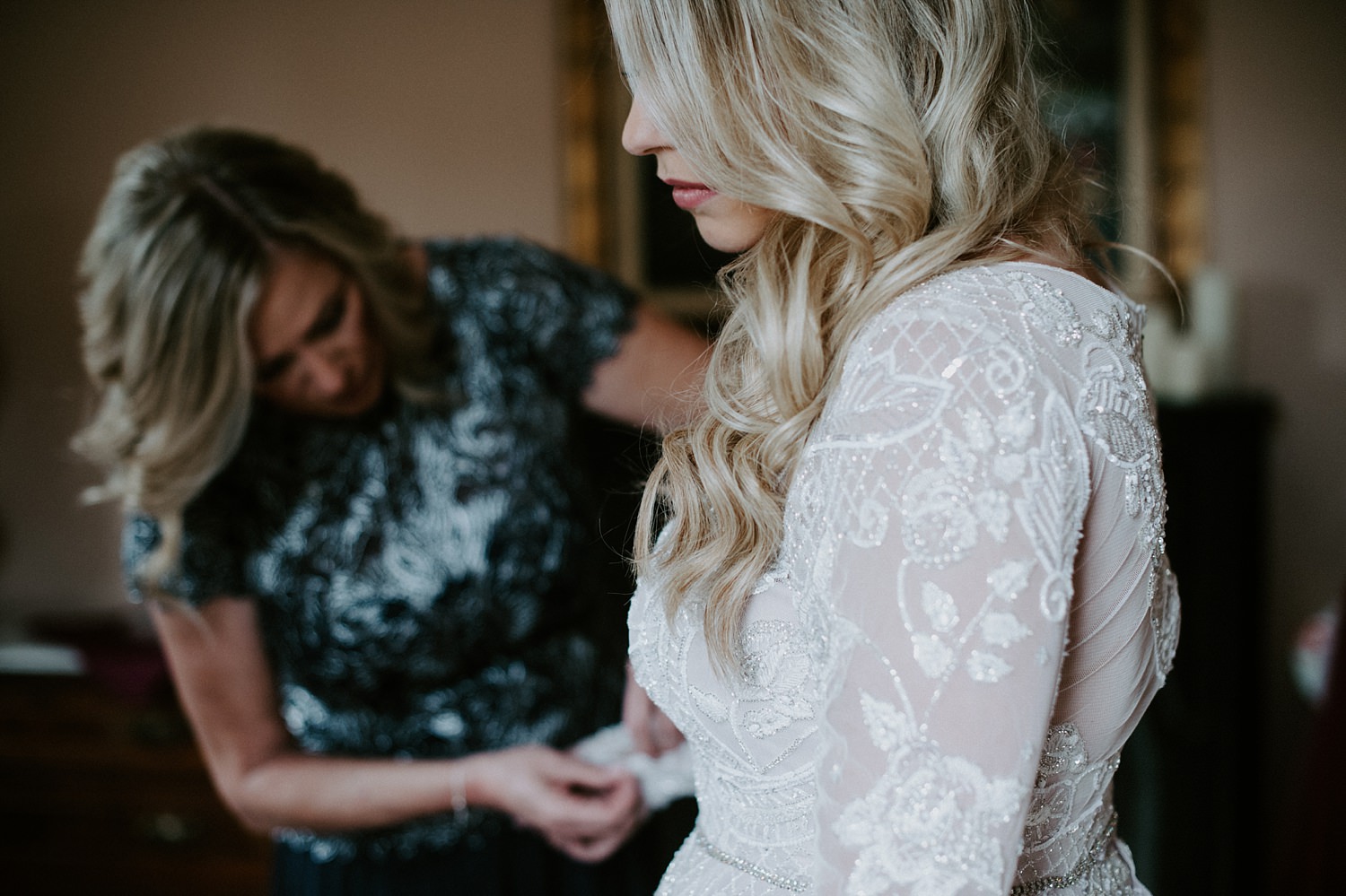 Gorgeous bride in long sleeve, blush wedding gown at The Webb Barn