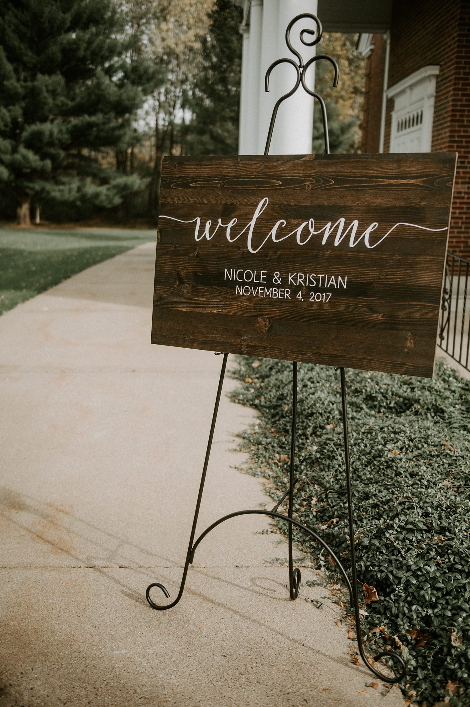 Rustic wooden ceremony welcome sign at The Webb Barn in Wethersfield, CT